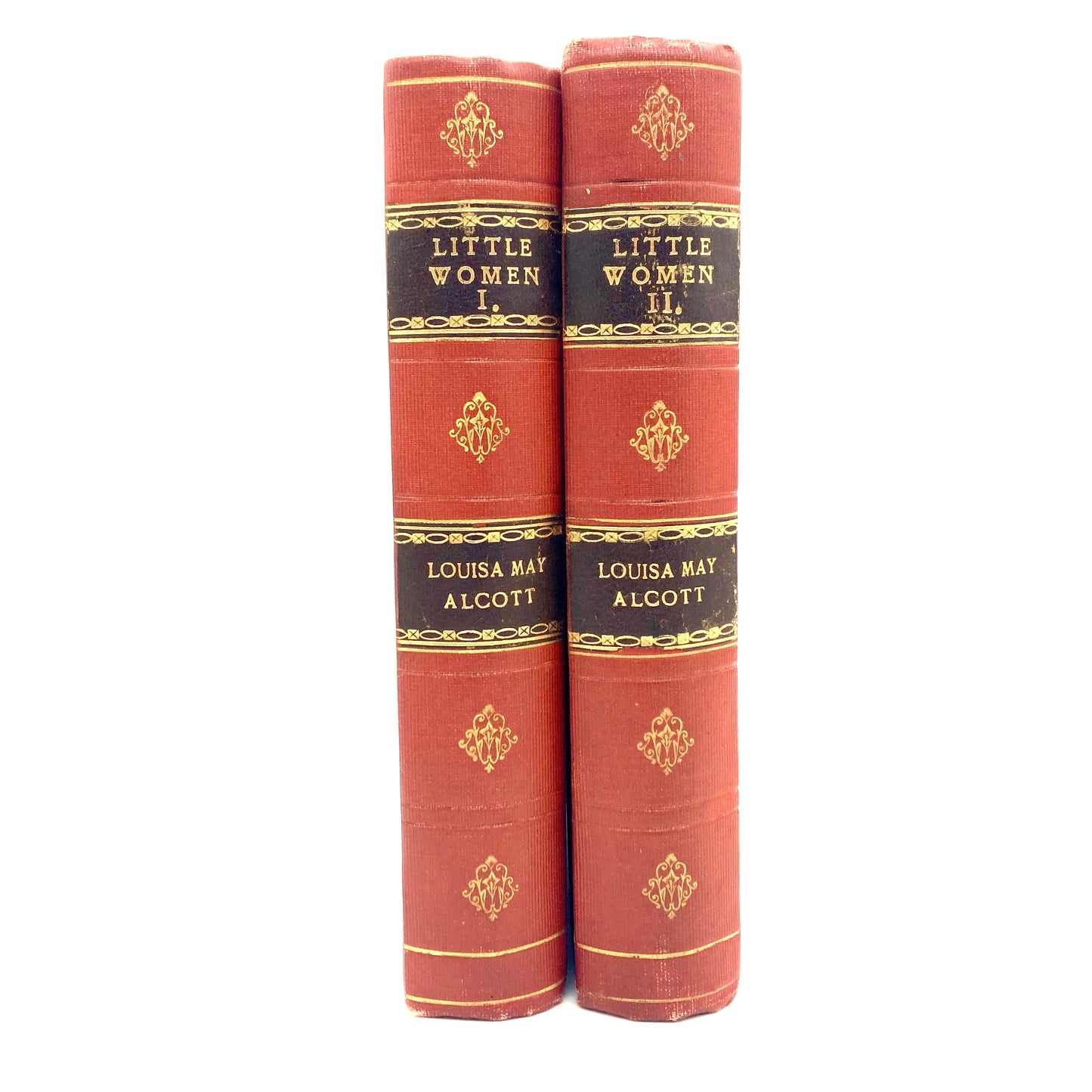 Two red books titled 'Little Women' by Louisa May Alcott on a white background