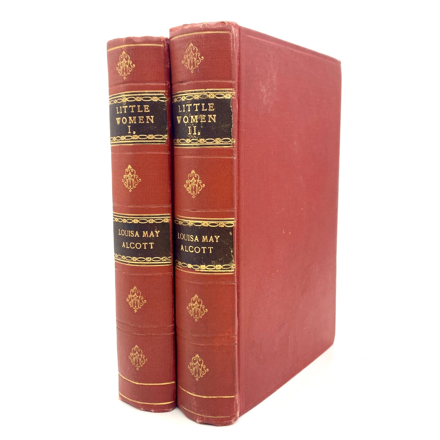 Two red books titled 'Little Women' by Louisa May Alcott on a white background